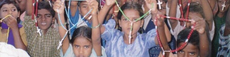 Children holding rosaries